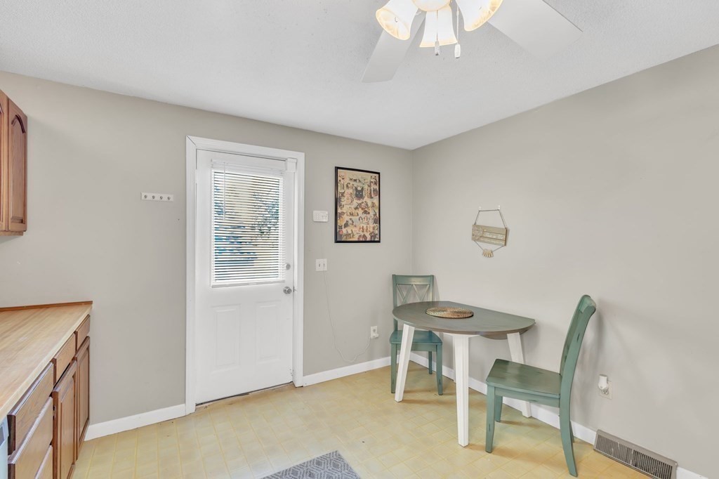 1638 Parker Street Springfield, MA 01128 - Photo 7 of 36 a view of a dining room with furniture and a chandelier fan