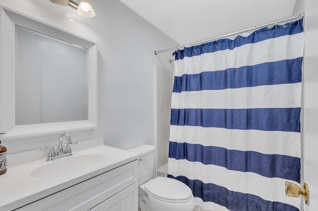 1638 Parker Street Springfield, MA 01128 - Photo 9 of 36 a bathroom with a sink and a mirror