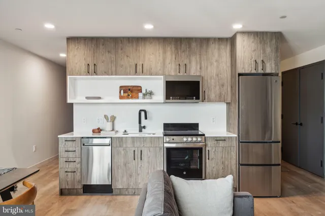 a bedroom with a bed and a lamp on table