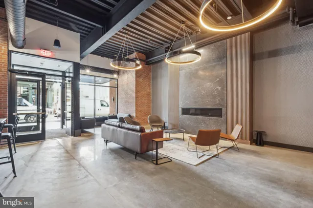 a outdoor space with lots of chairs and a projector