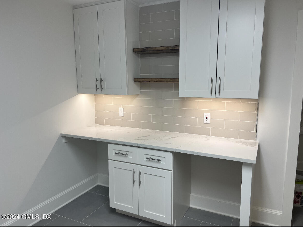 45 Bible Street, Unit 2 Cos Cob, CT 06807 - Photo 3 of 12 a kitchen with a sink and cabinets