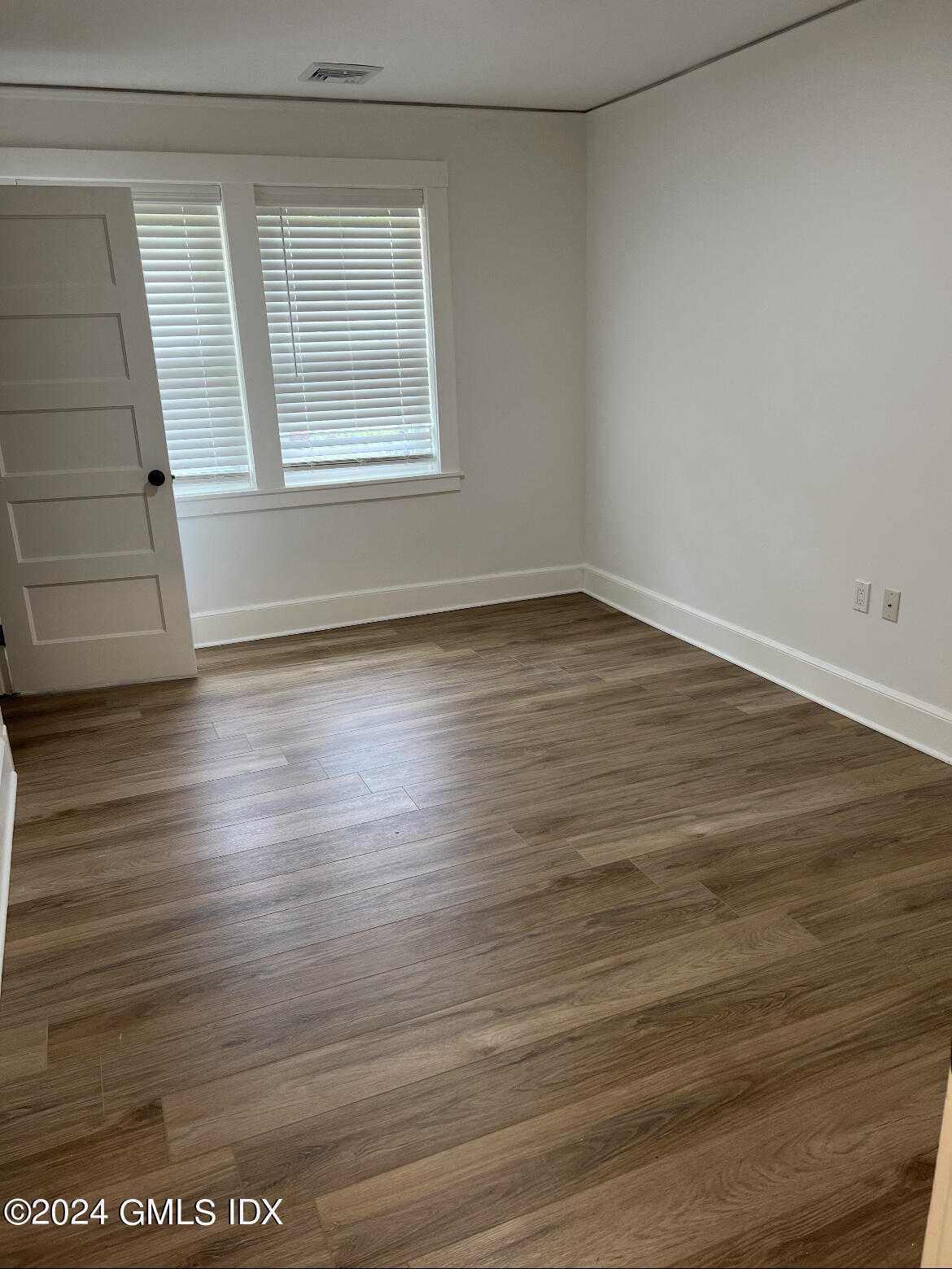 45 Bible Street, Unit 2 Cos Cob, CT 06807 - Photo 8 of 12 wooden floor in an empty room