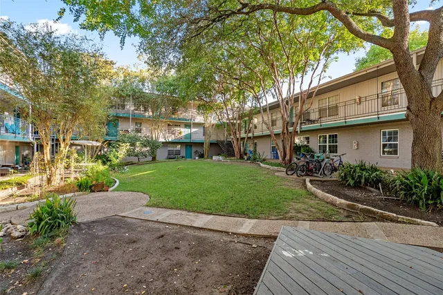 a view of a street with houses on both side