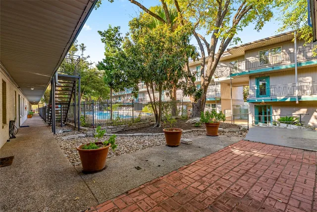 a view of a backyard with sitting area