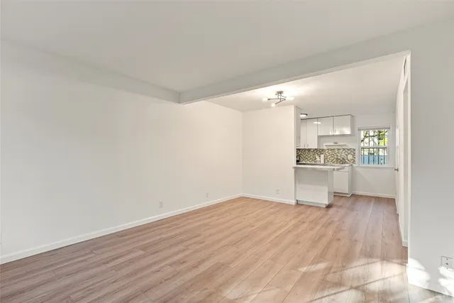 a view of kitchen with wooden floor