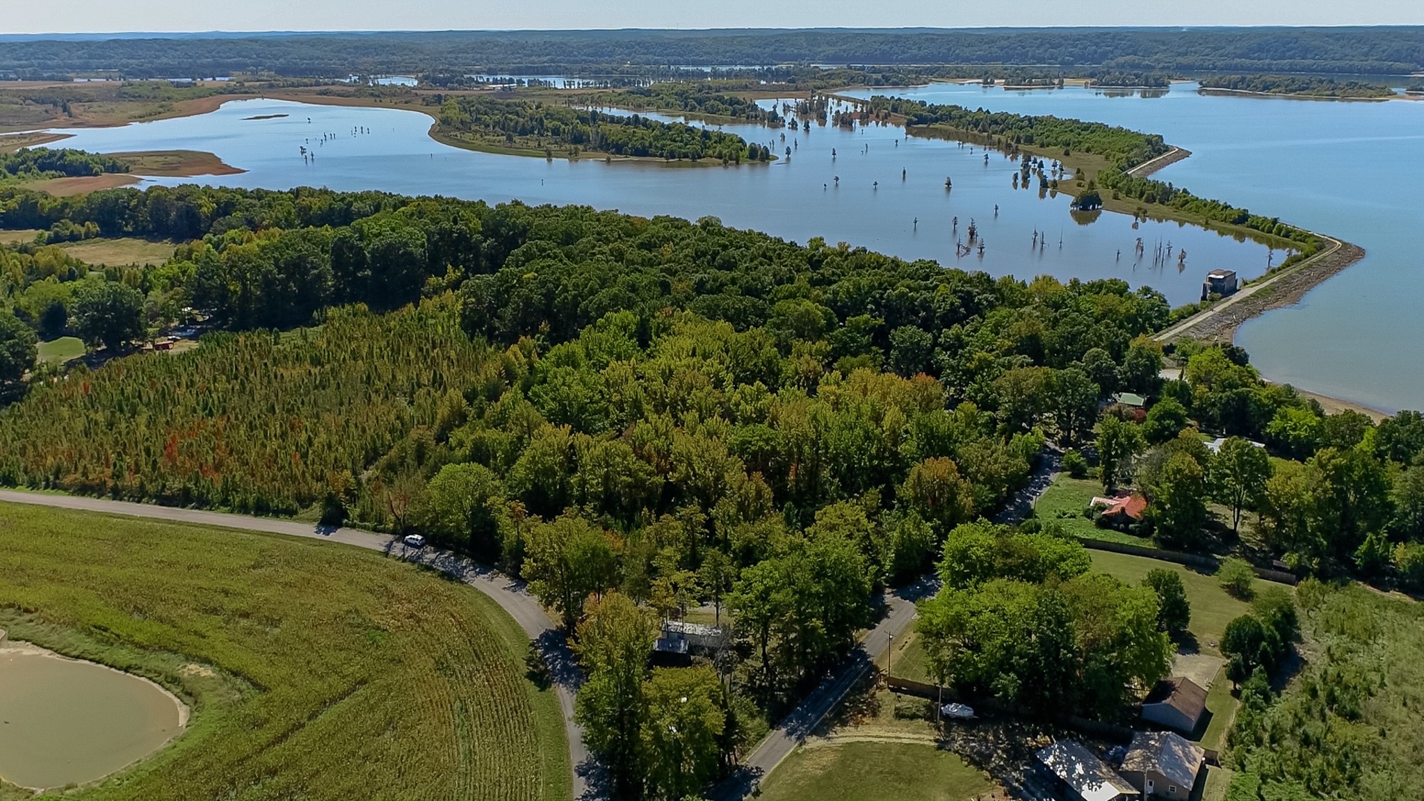 an aerial view of a houses with a lake view