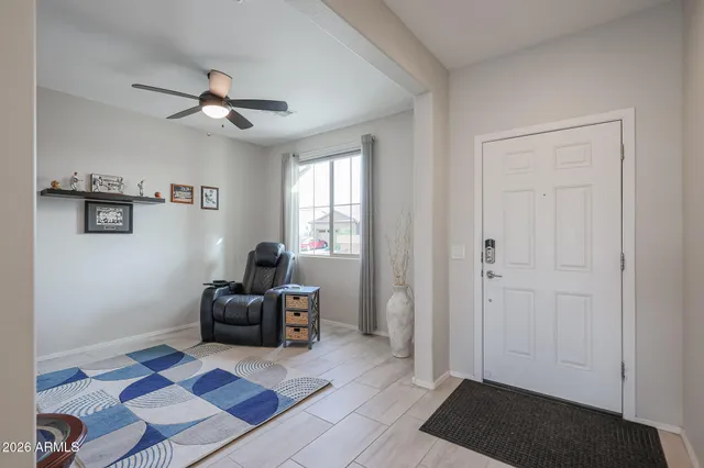 a living room with furniture and a rug