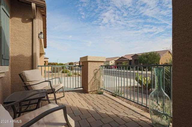 a view of a balcony with furniture
