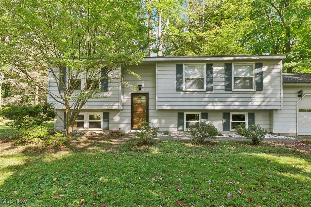 1625 Travers Road Madison, OH 44057 - Photo 1 of 41 Split foyer home with a front lawn and an attached garage