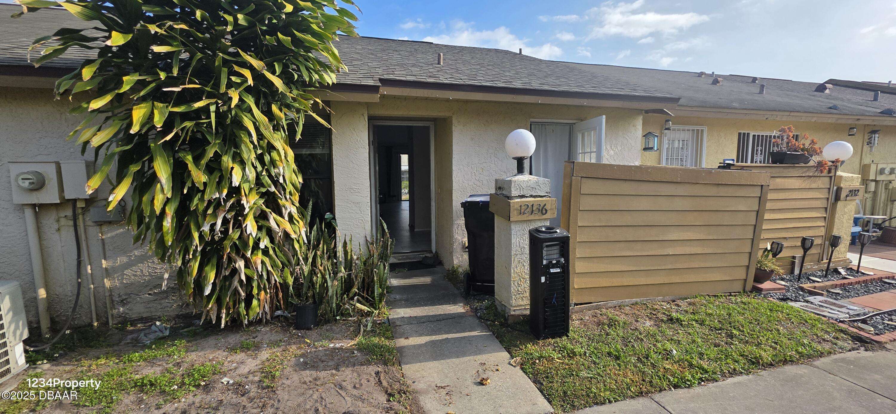12136 Sand Pebble Way Orlando, FL 32824 - Photo 3 of 14 a view of a house with a tree