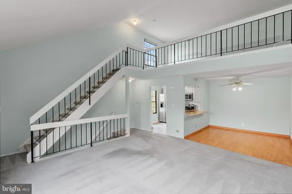a view of staircase with white walls