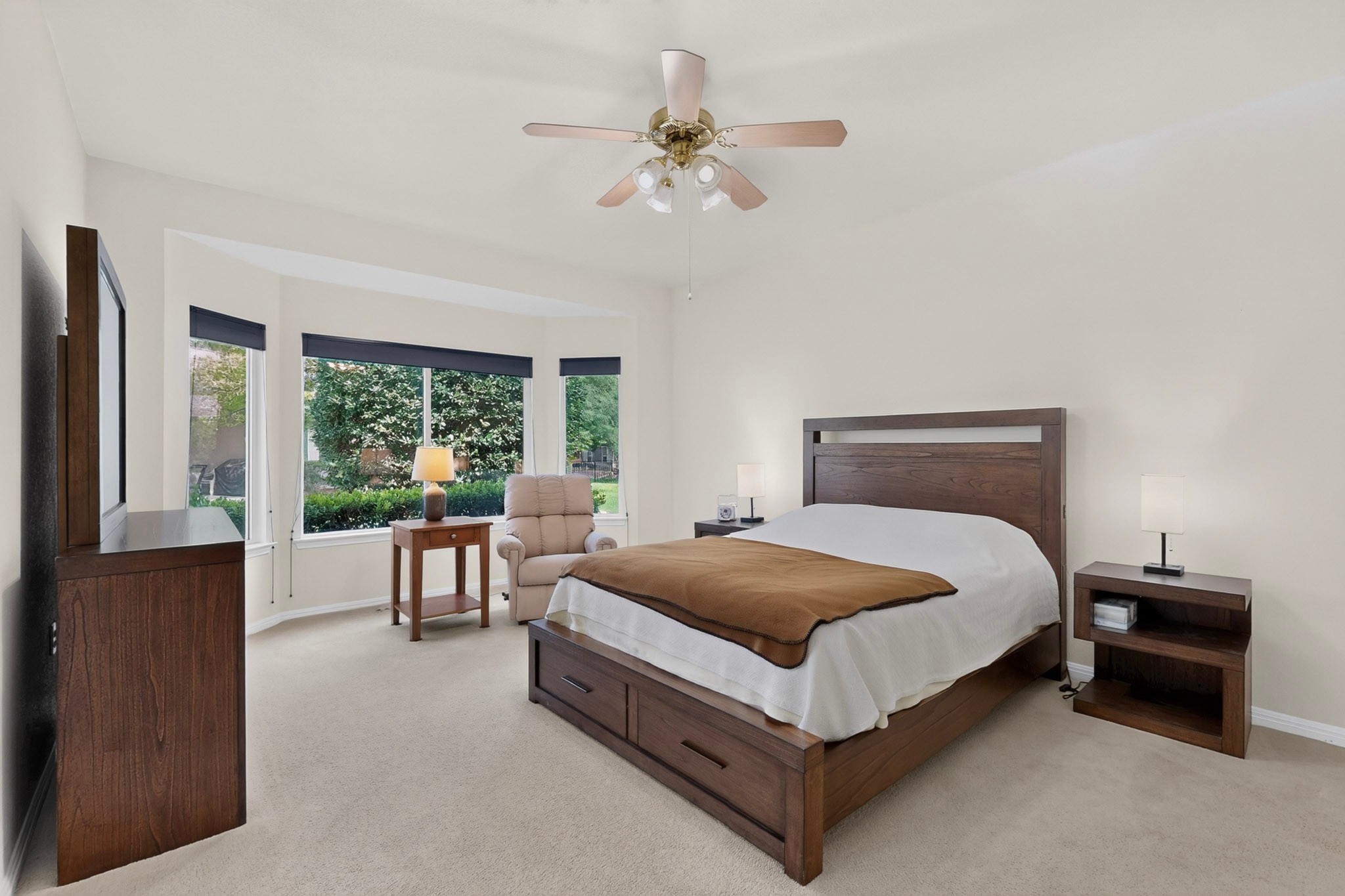 207 Red Poppy Trail Georgetown, TX 78633 - Photo 16 of 31 Well-lit primary bedroom features a bay window.
