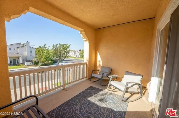 a balcony view with a couch