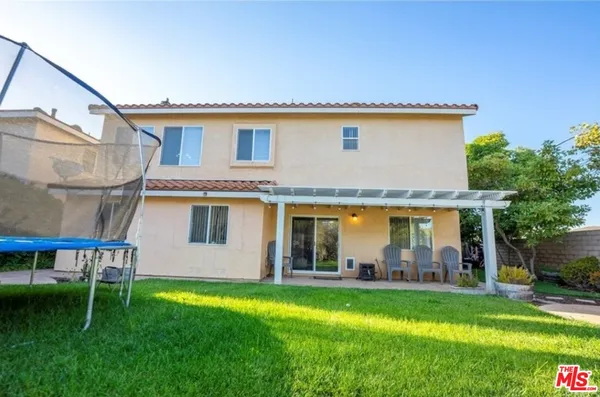 a view of a back yard of the house