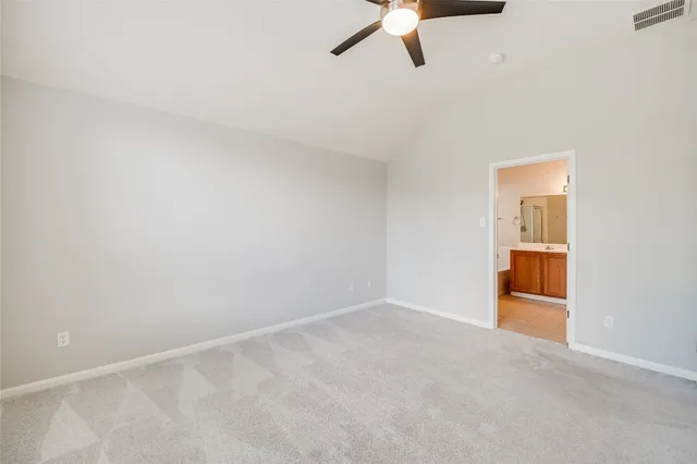 an empty room with a empty space and windows