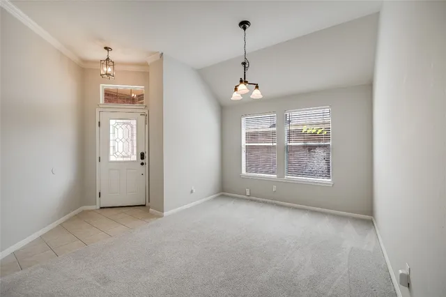 a view of an empty room with windows