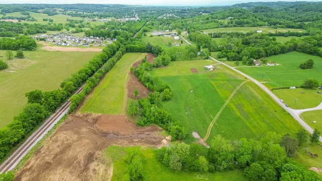 a view of a field with sitting area