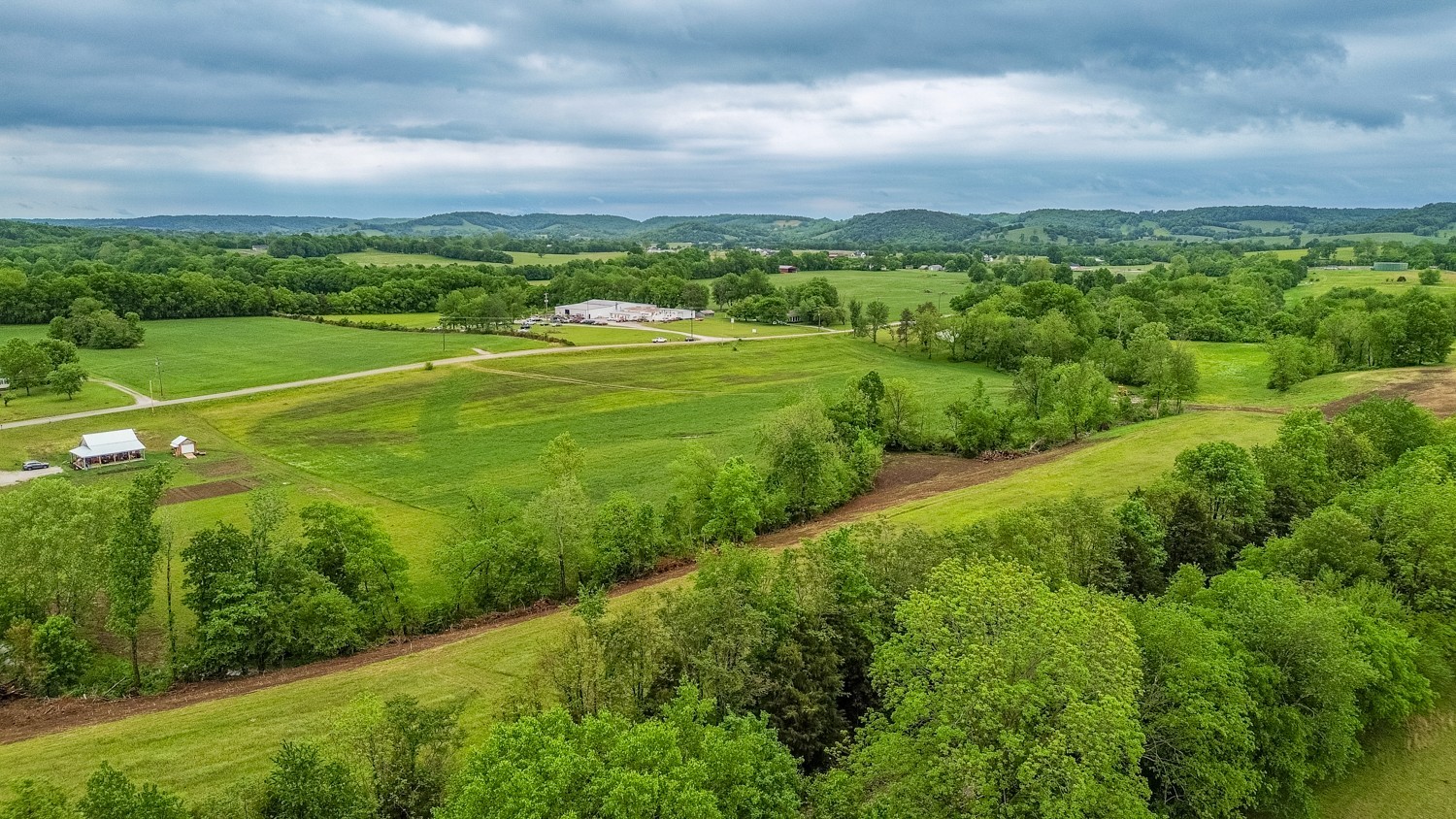 0 Ostella Road Cornersville, TN 37047 - Photo 15 of 37 a view of a city with lush green forest
