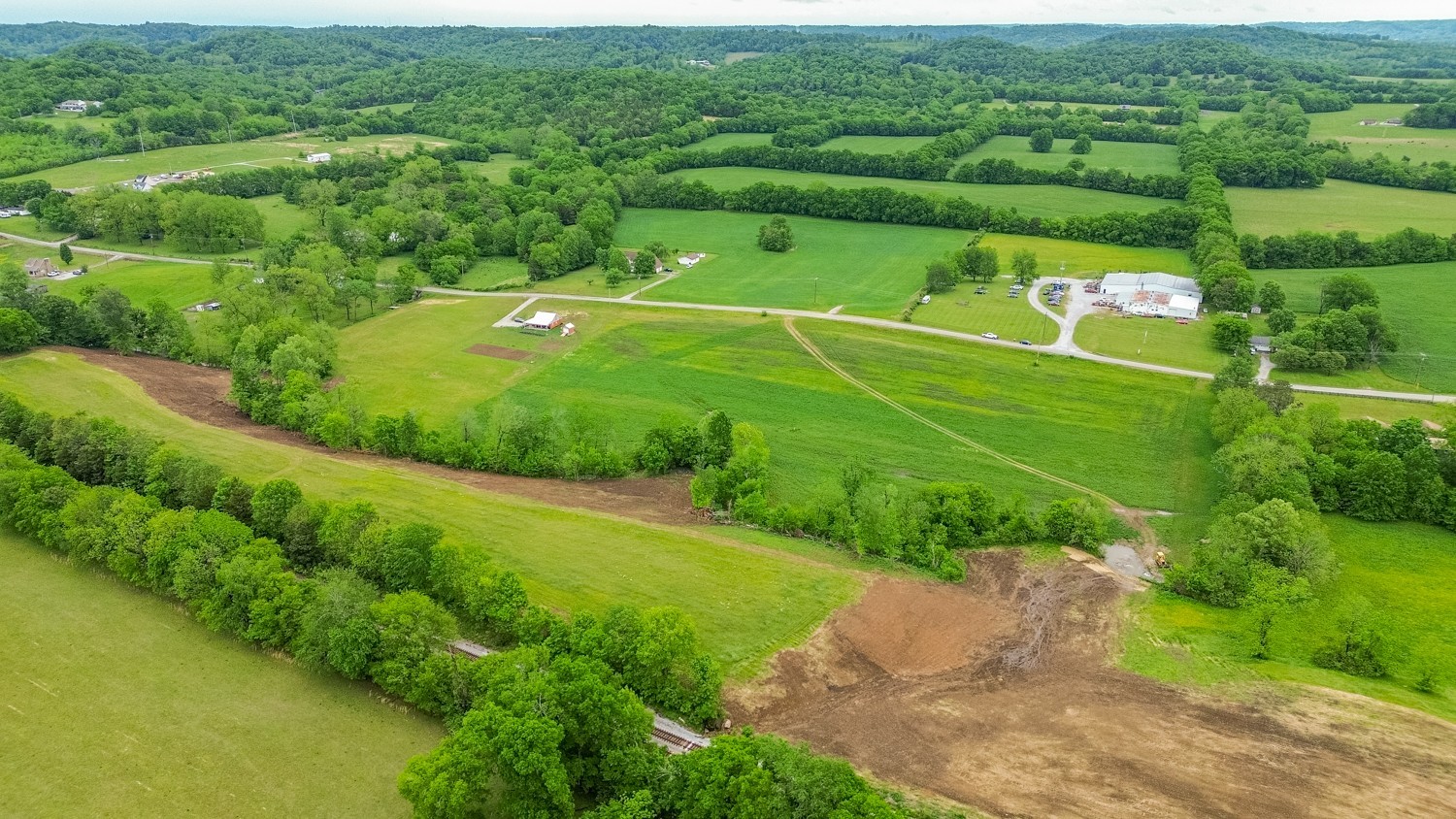 0 Ostella Road Cornersville, TN 37047 - Photo 6 of 37 a view of a golf course with a lake