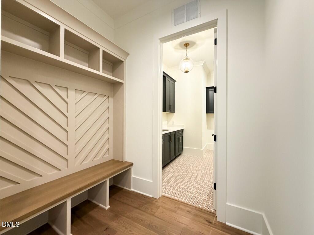 7441 Summer Tanager Trail Raleigh, NC 27614 - Photo 39 of 48 a view of a hallway with entryway and wooden floor