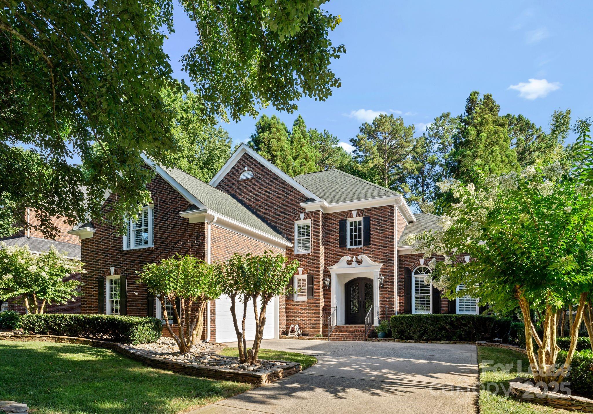18807 Dembridge Drive Davidson, NC 28036 - Photo 1 of 35 a front view of a house with a yard