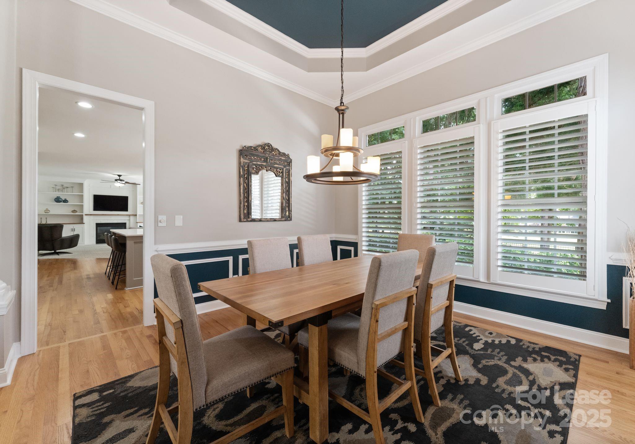 18807 Dembridge Drive Davidson, NC 28036 - Photo 18 of 35 a view of a dining room with furniture window and wooden floor