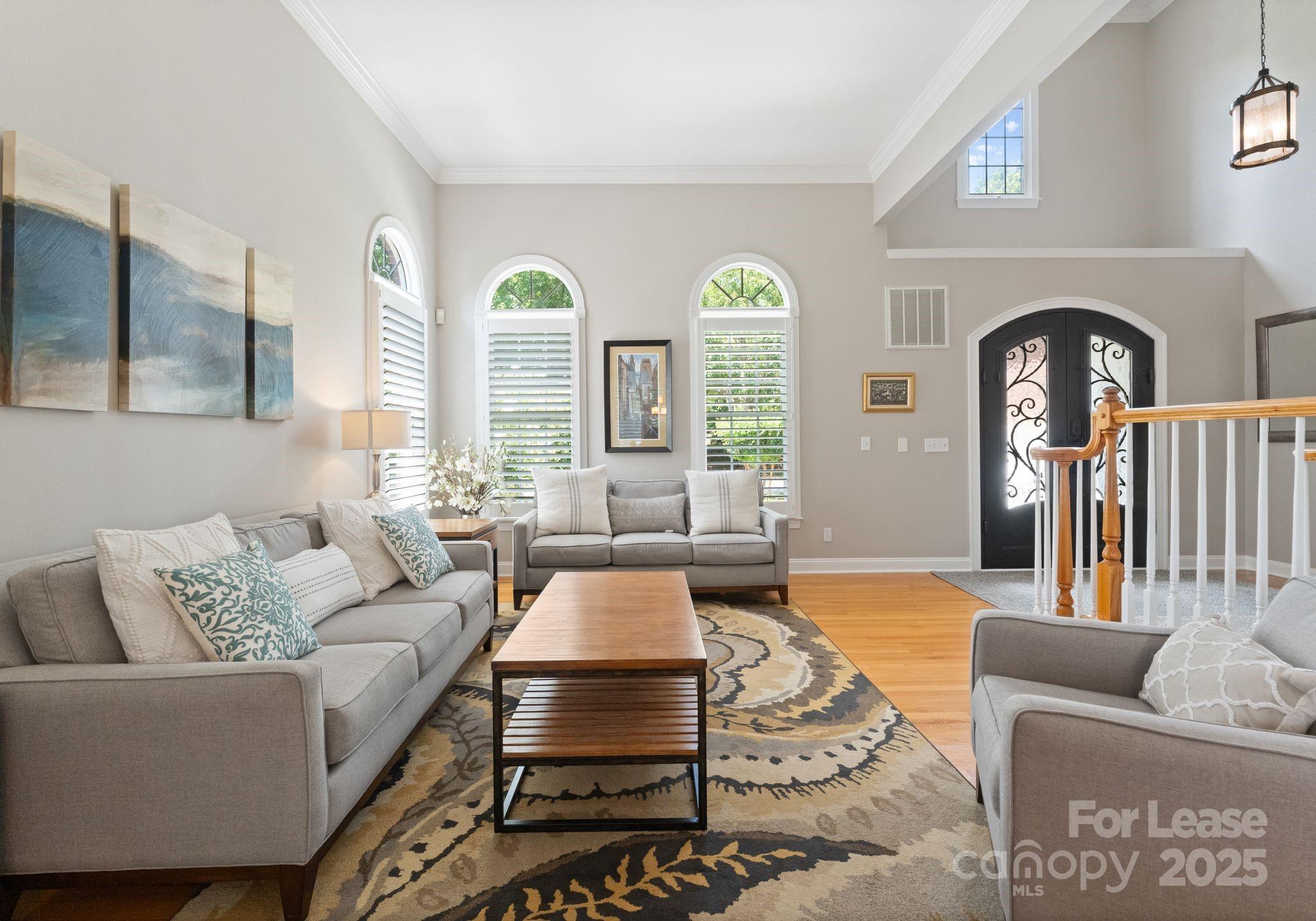 18807 Dembridge Drive Davidson, NC 28036 - Photo 19 of 35 a living room with furniture and a large window