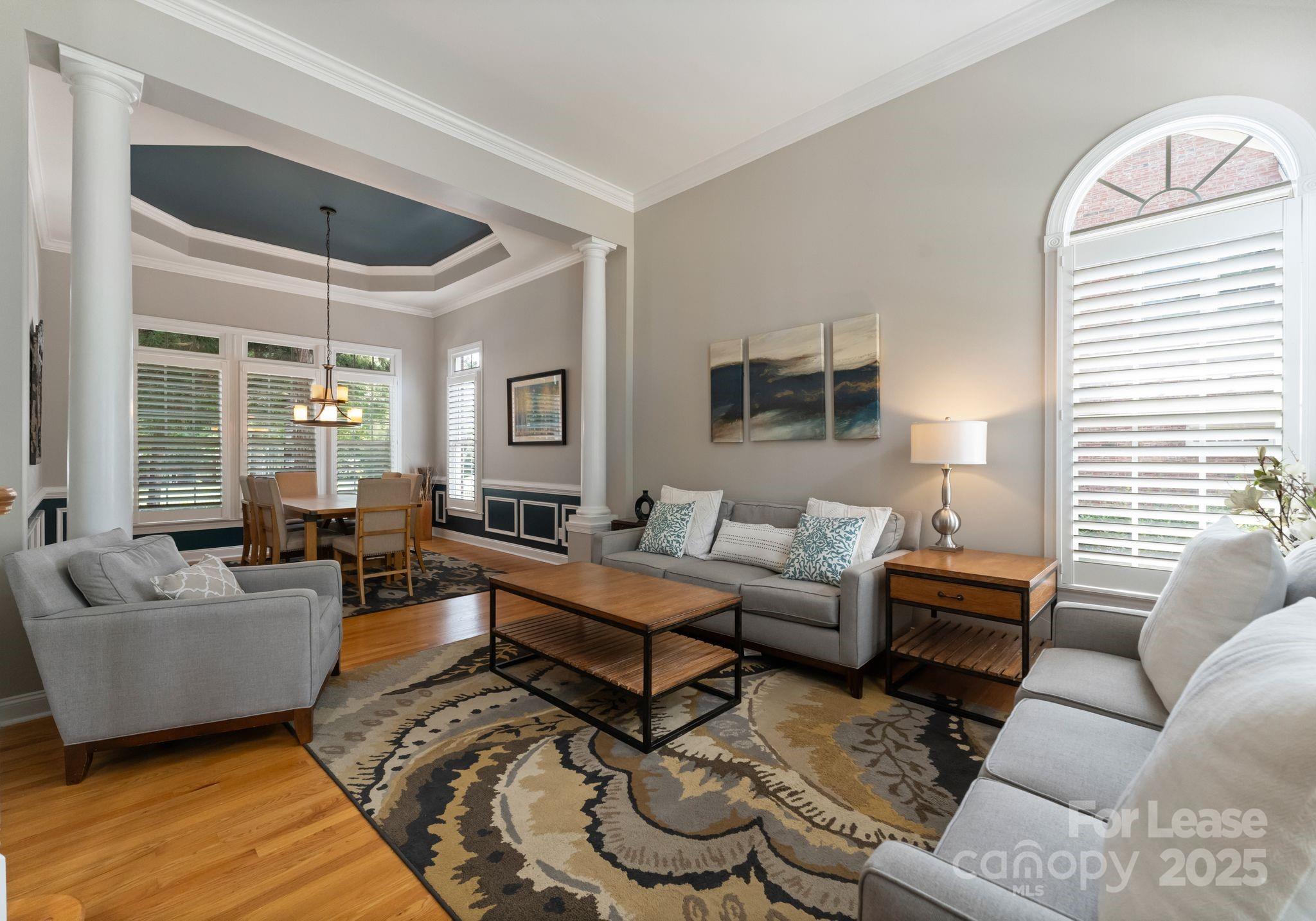 18807 Dembridge Drive Davidson, NC 28036 - Photo 20 of 35 a living room with furniture and a large window