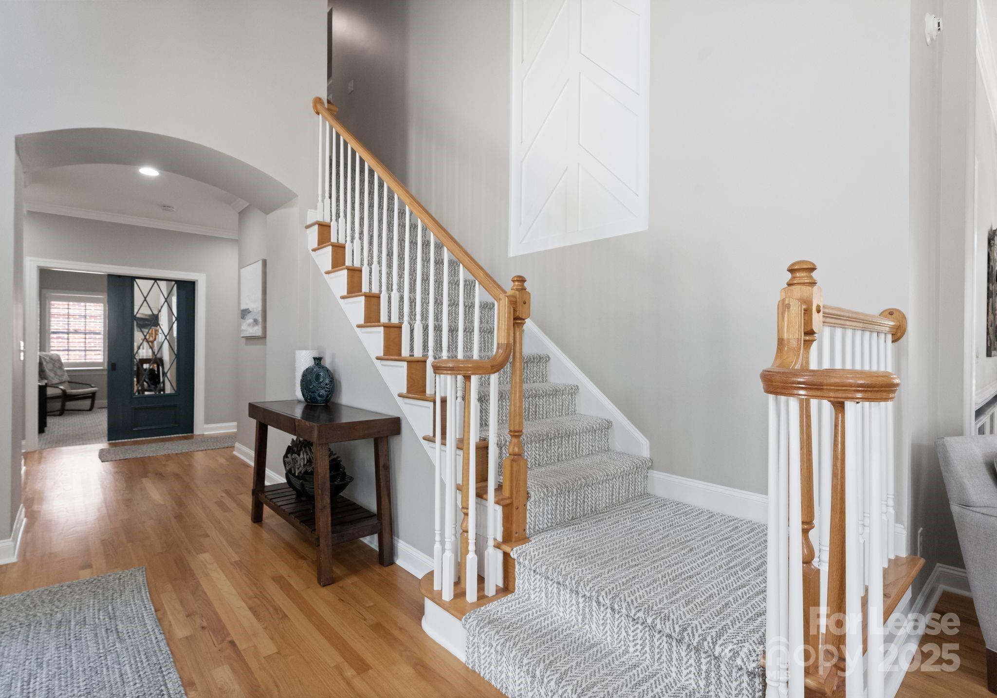 18807 Dembridge Drive Davidson, NC 28036 - Photo 2 of 35 a view of entryway and hall with wooden floor