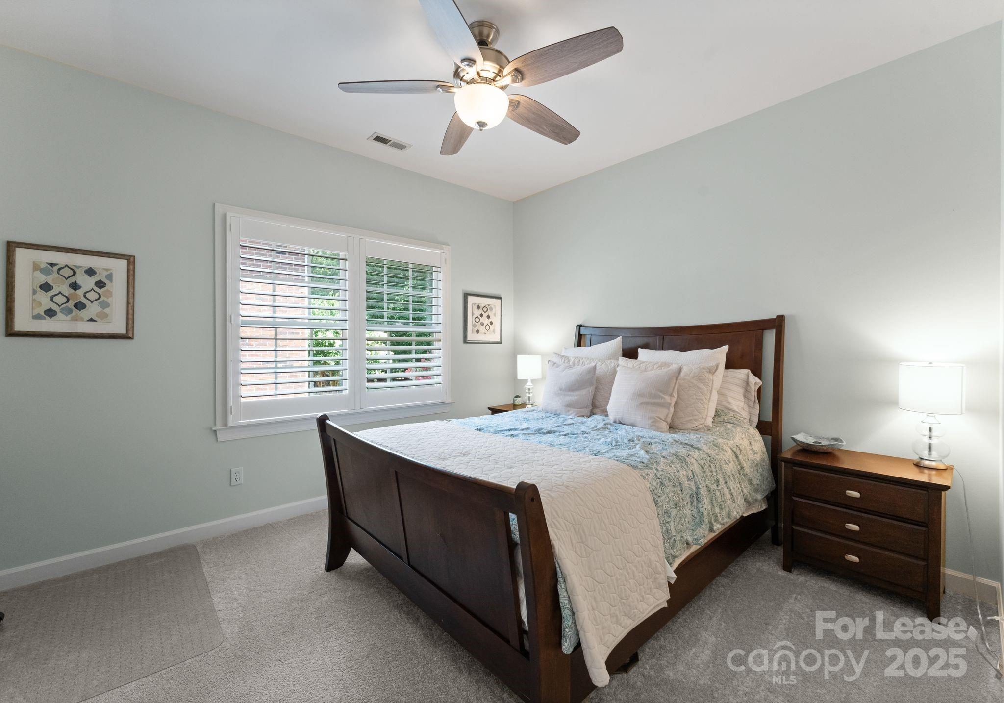 18807 Dembridge Drive Davidson, NC 28036 - Photo 26 of 35 a bedroom with a bed and a window