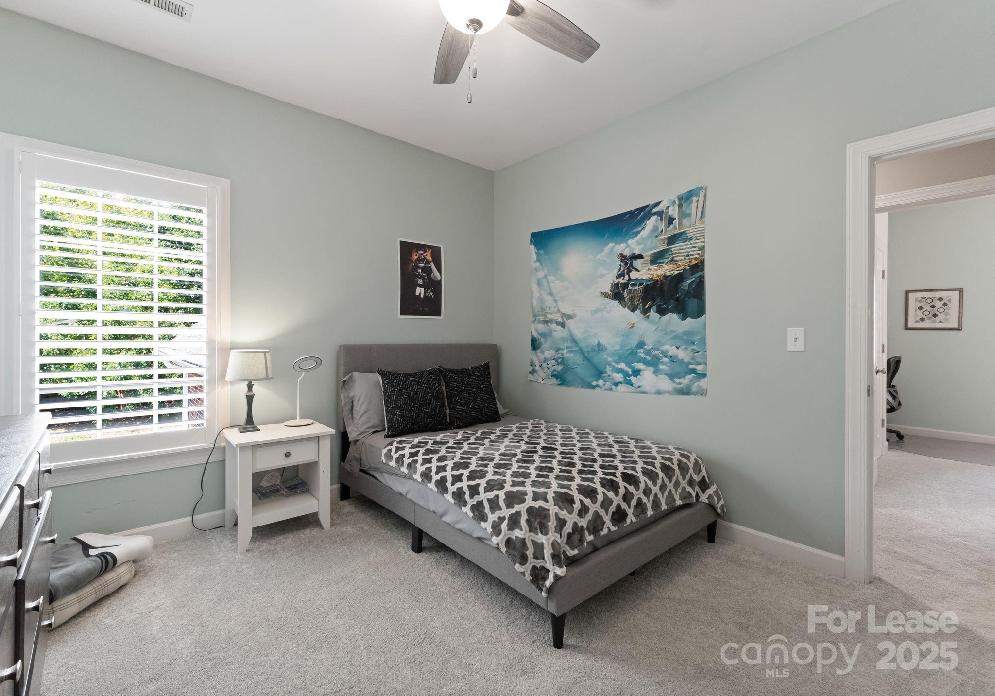 18807 Dembridge Drive Davidson, NC 28036 - Photo 27 of 35 a bedroom with a bed and a window