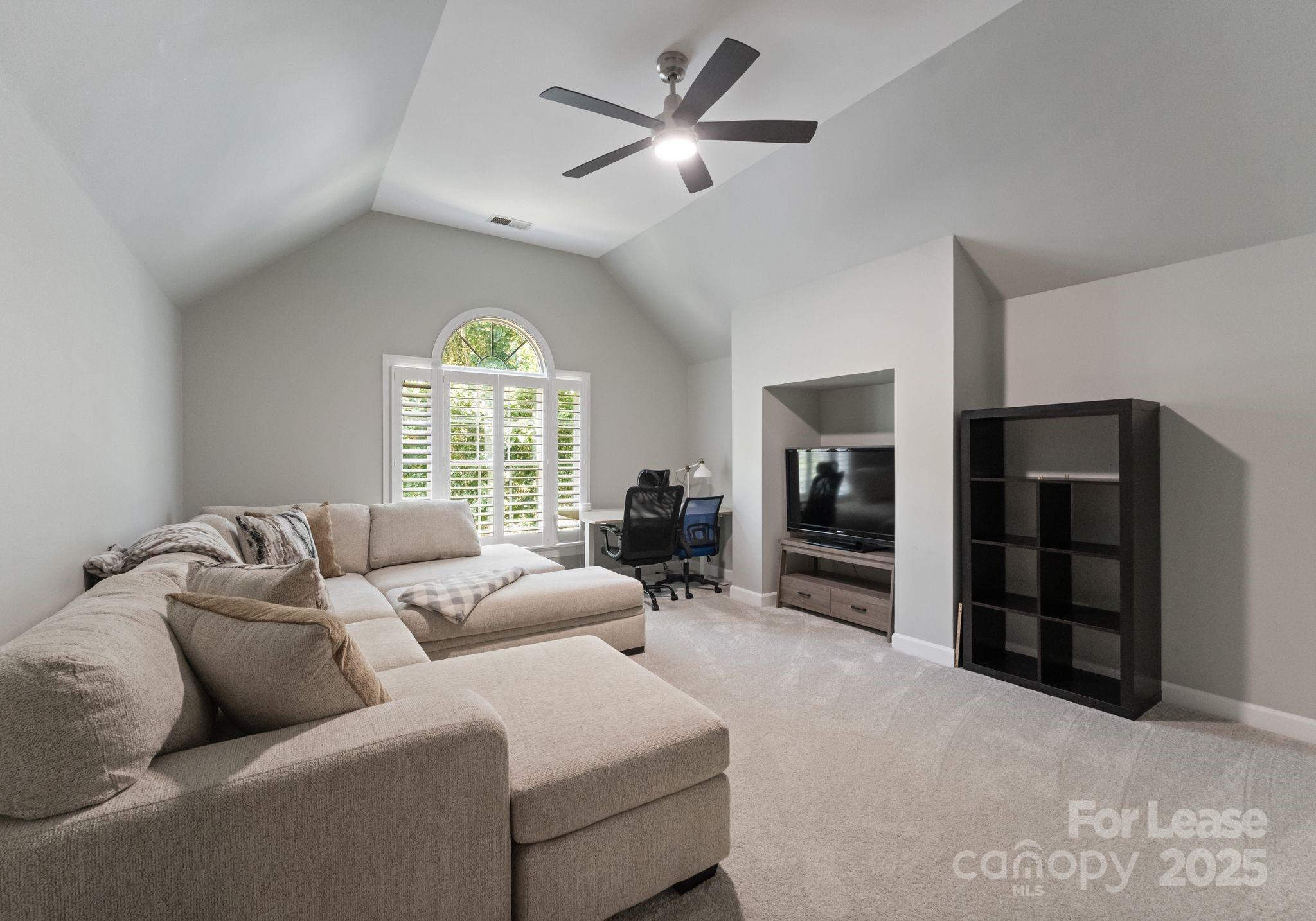 18807 Dembridge Drive Davidson, NC 28036 - Photo 29 of 35 a living room with furniture and a large window