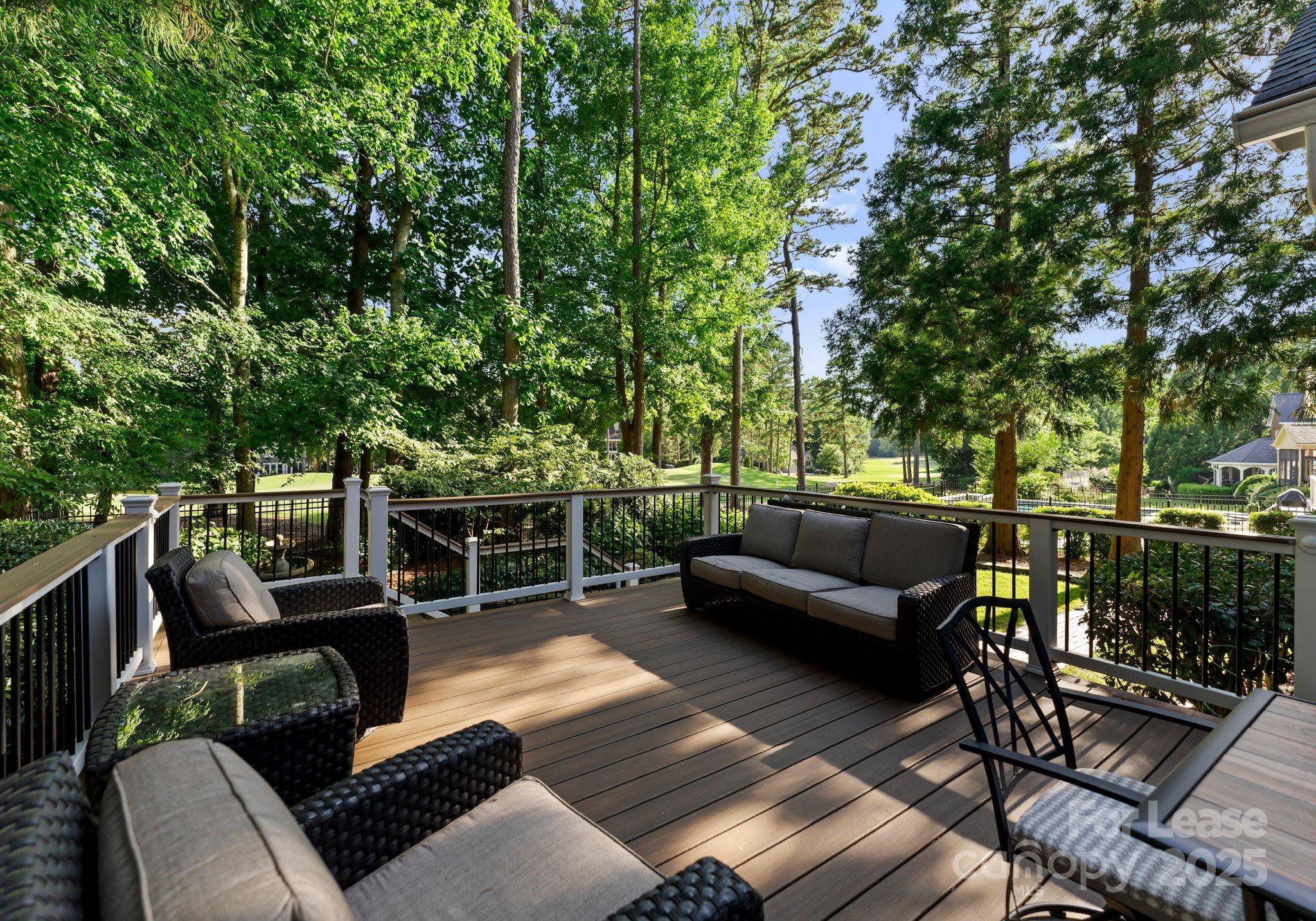 18807 Dembridge Drive Davidson, NC 28036 - Photo 33 of 35 a view of a patio with couches chairs and wooden floor