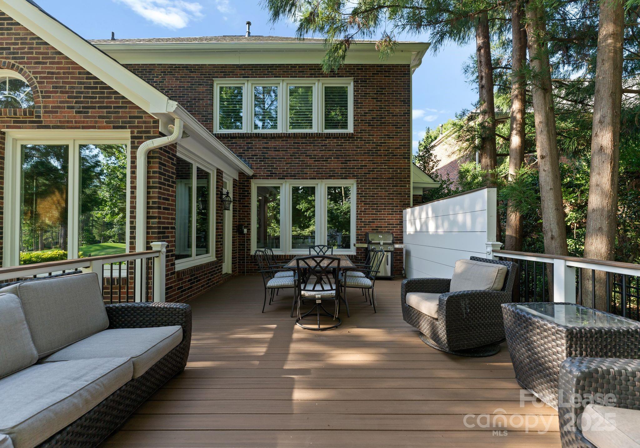 18807 Dembridge Drive Davidson, NC 28036 - Photo 34 of 35 a view of a patio with couches table and chairs and potted plants