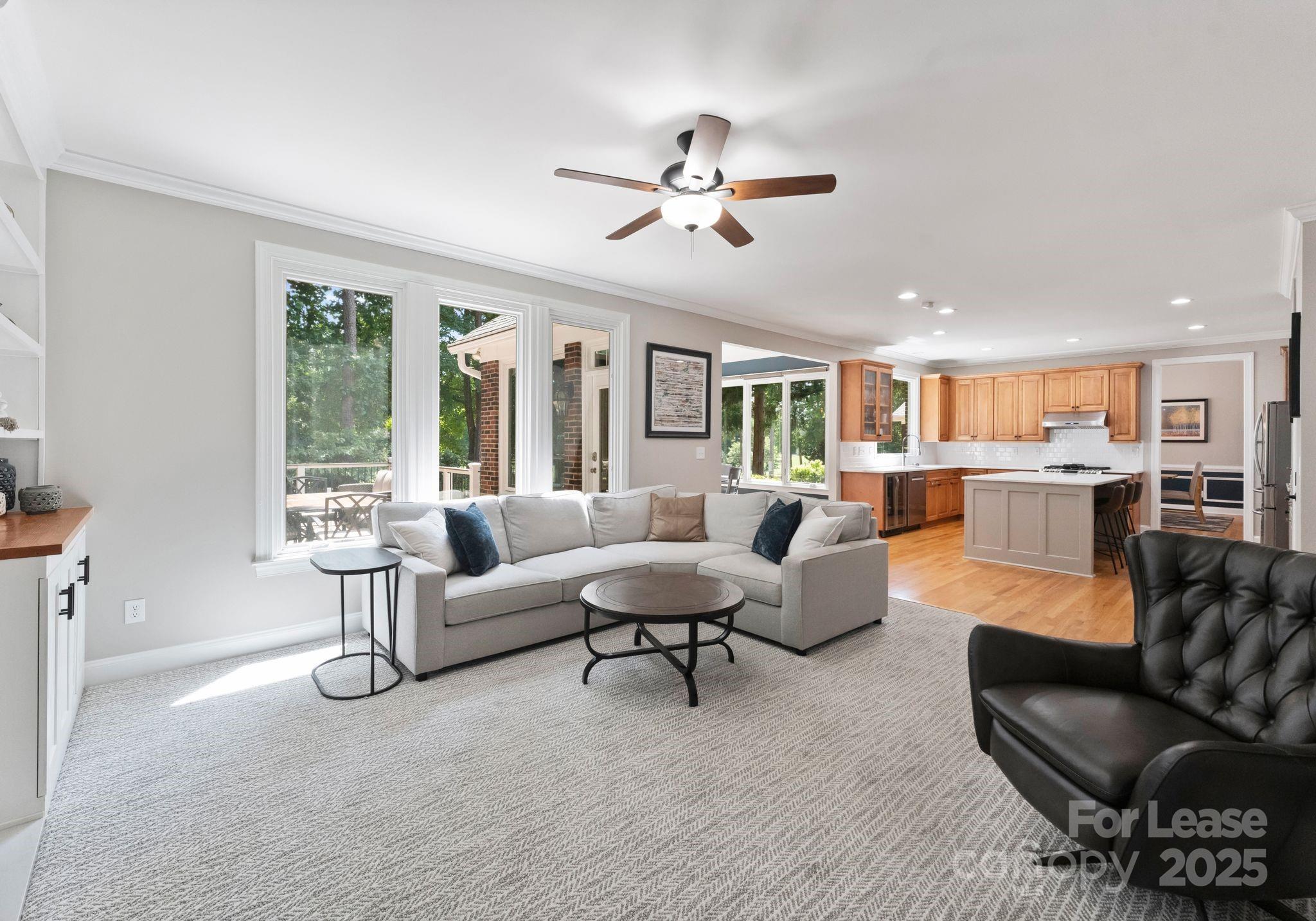 18807 Dembridge Drive Davidson, NC 28036 - Photo 10 of 35 a living room with furniture and a large window