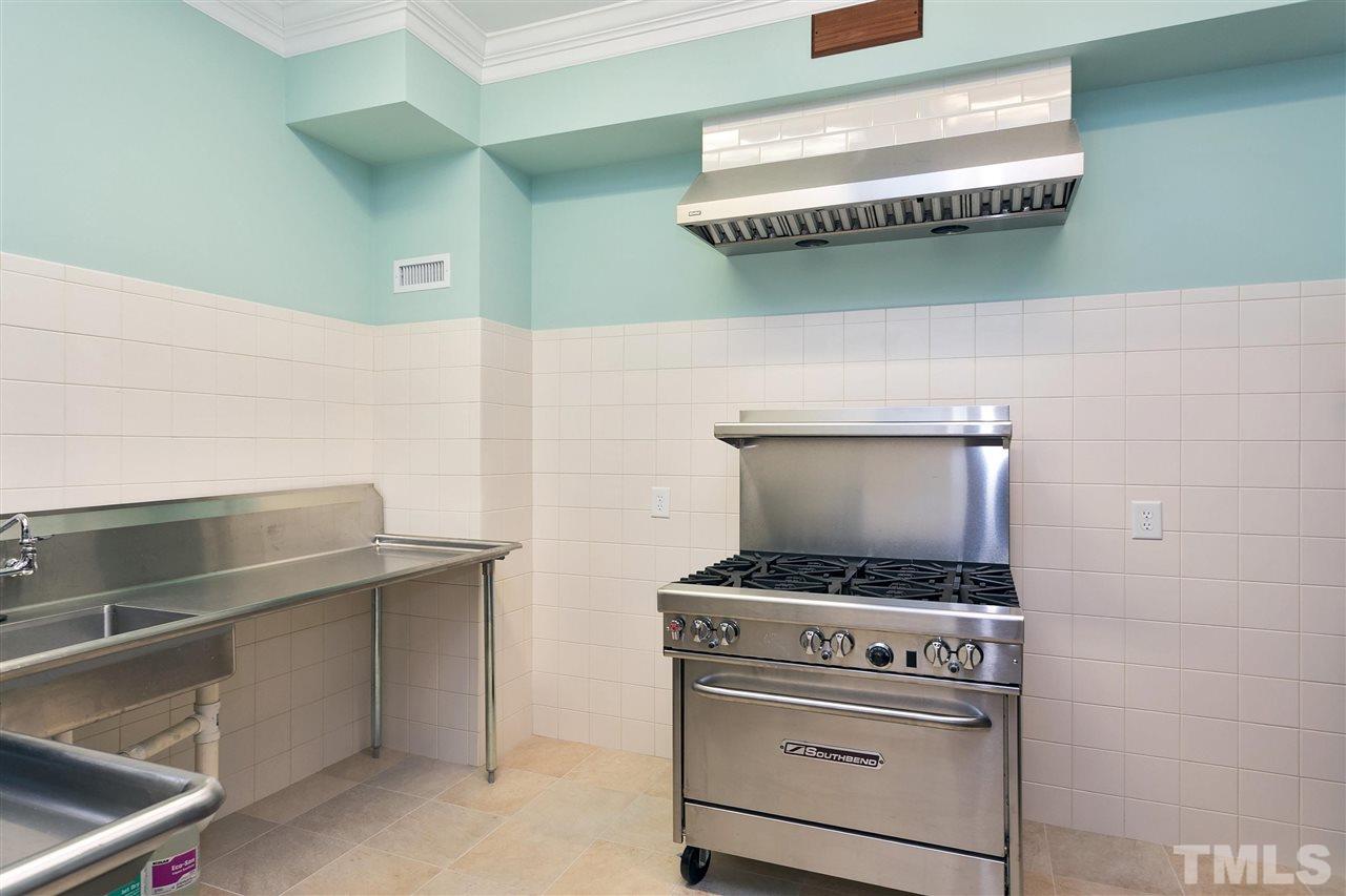 302 Annandale Drive Cary, NC 27511 - Photo 12 of 30 a stove top oven sitting inside of a kitchen