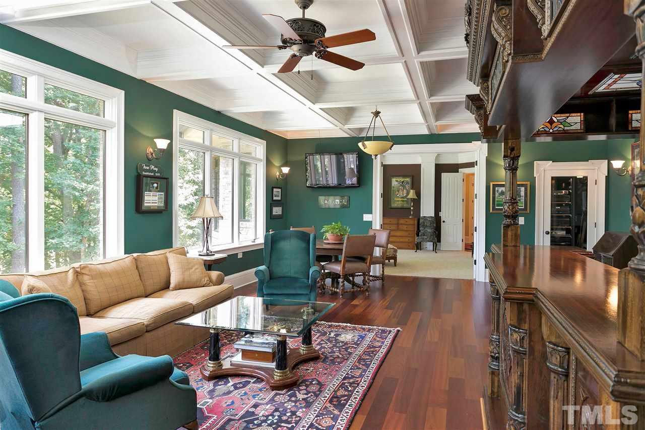 302 Annandale Drive Cary, NC 27511 - Photo 19 of 30 a living room with furniture a fireplace and a large window