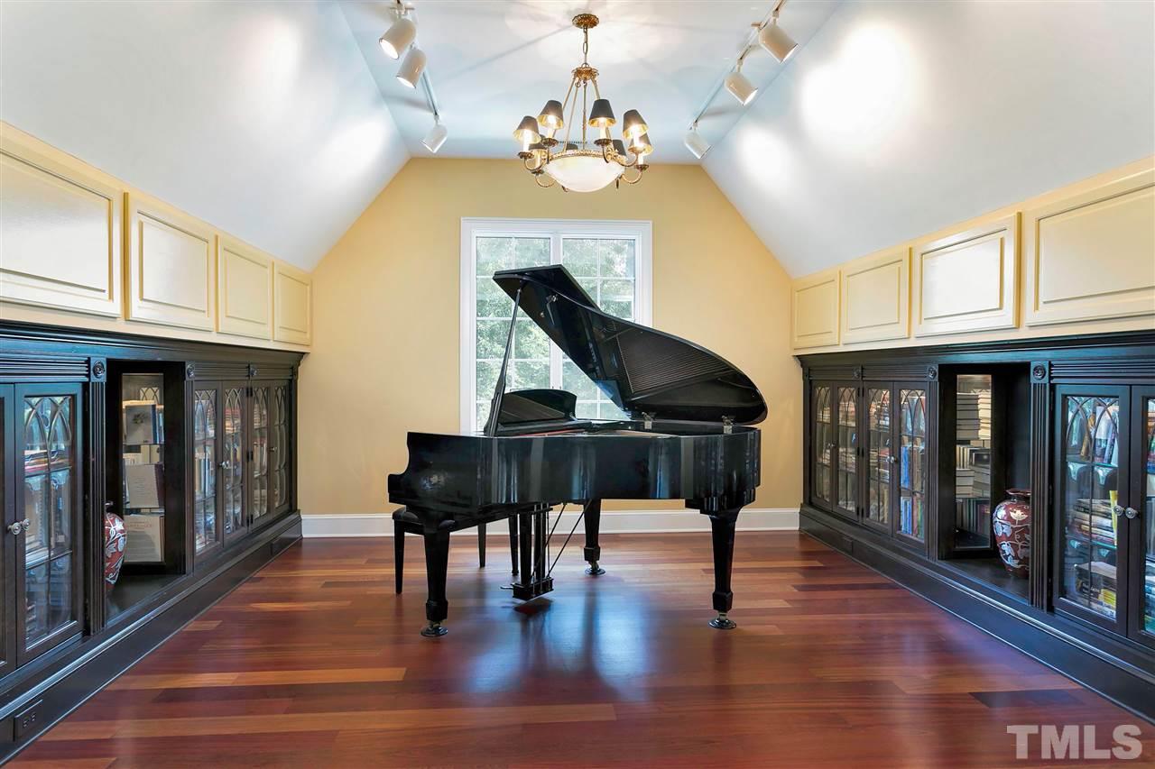 302 Annandale Drive Cary, NC 27511 - Photo 22 of 30 a view of entryway dining room and hall with wooden floor