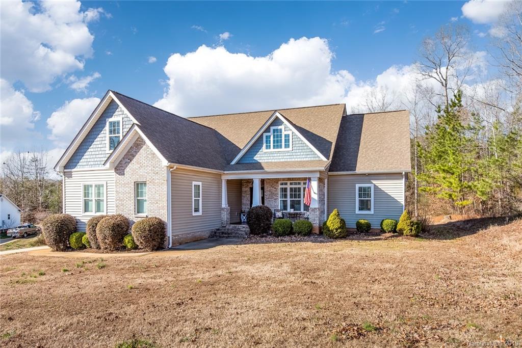 2056 Roadrunner Road Clover, SC 29710 - Photo 2 of 25 a front view of a house with garden