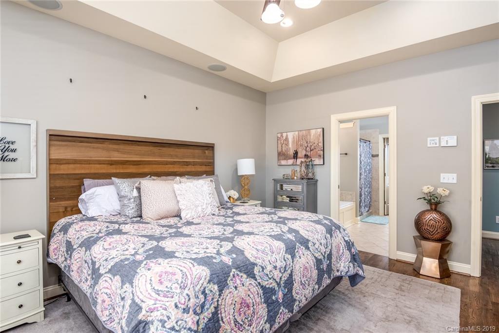 2056 Roadrunner Road Clover, SC 29710 - Photo 11 of 25 a bedroom with a large bed and chandelier