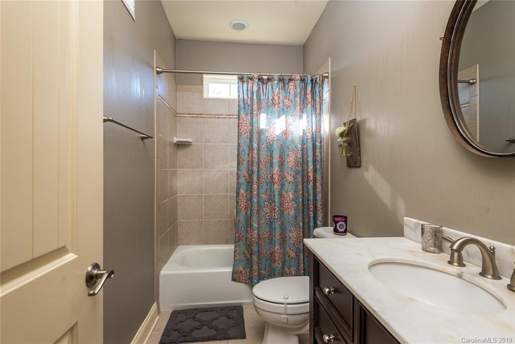 2056 Roadrunner Road Clover, SC 29710 - Photo 16 of 25 a bathroom with a sink toilet and shower