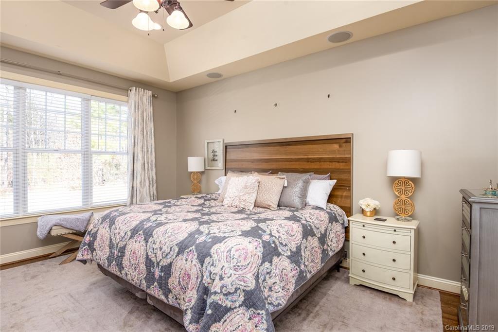 2056 Roadrunner Road Clover, SC 29710 - Photo 10 of 25 a bedroom with a bed and a chandelier
