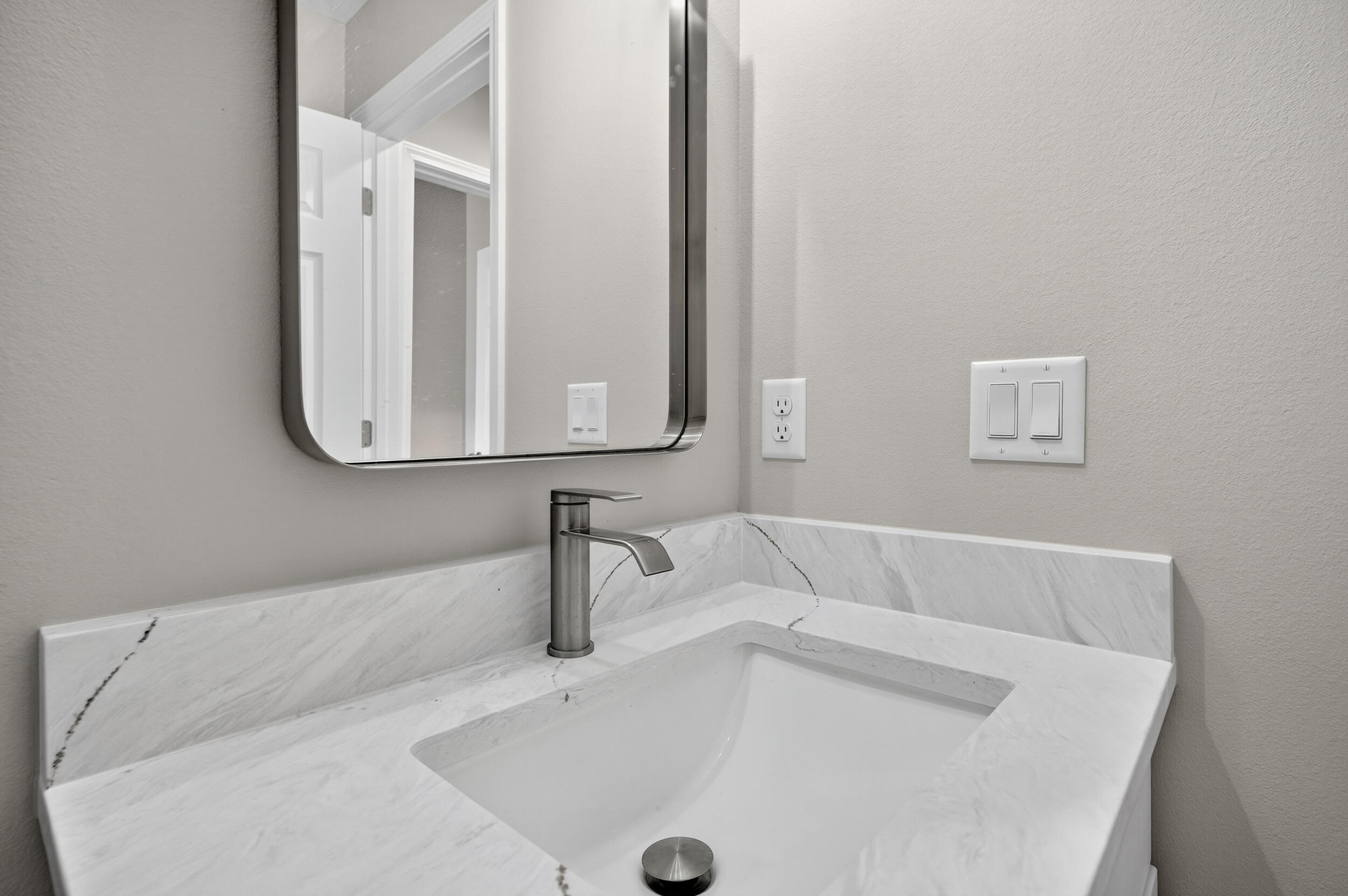 5325 B Kervin Road Crestview, FL 32539 - Photo 32 of 44 a bathroom with a sink and a mirror