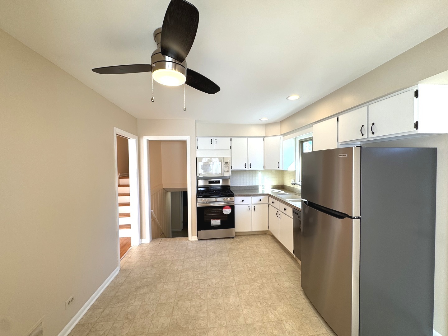 1042 West Central Road Mount Prospect, IL 60056 - Photo 15 of 32 a kitchen with refrigerator a stove and a refrigerator