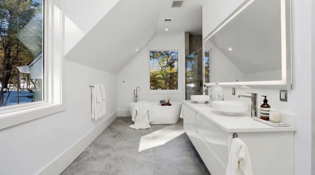 3 Effie Place Lexington, MA 02421 - Photo 6 of 9 a bathroom with a sink mirror and a bathtub