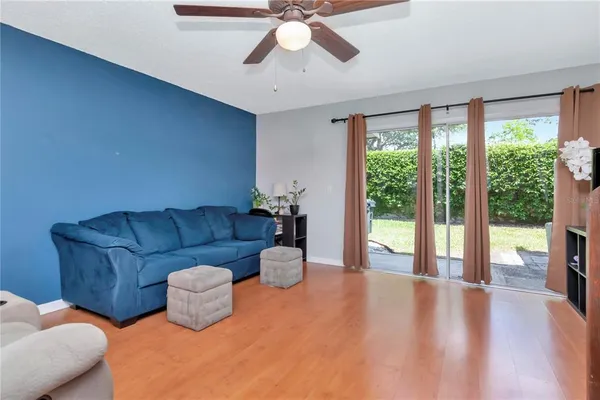 a living room with furniture and a large window