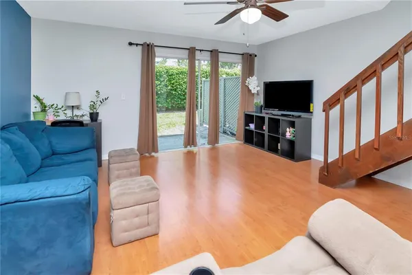 a living room with furniture and a flat screen tv