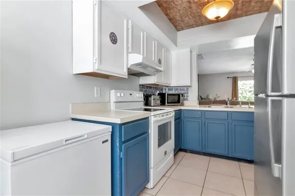 a kitchen with a sink and cabinets