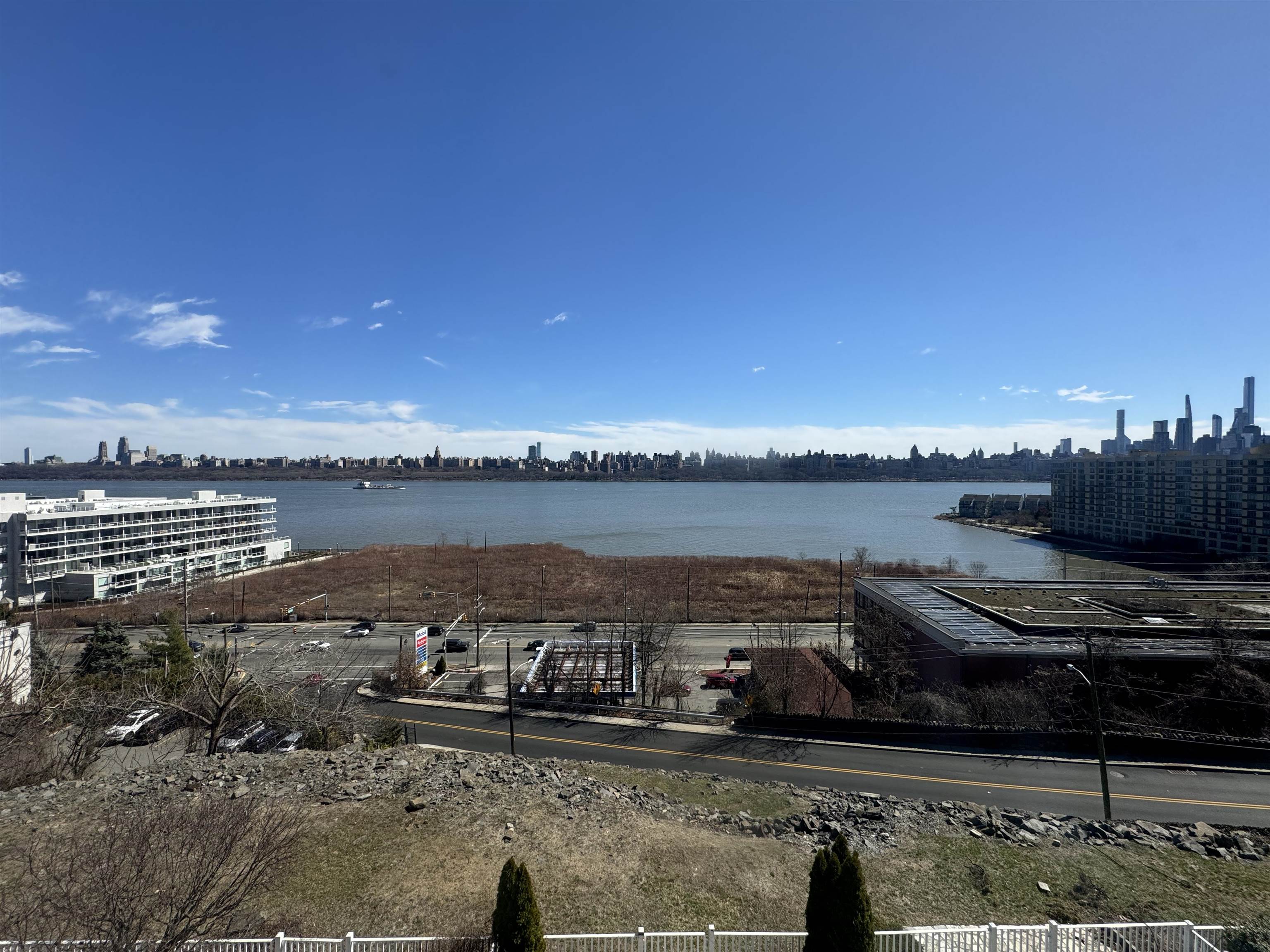 20 Bergen Ridge Road, Unit 2 North Bergen, NJ 07047 - Photo 4 of 16 a view of a lake with a building in the background