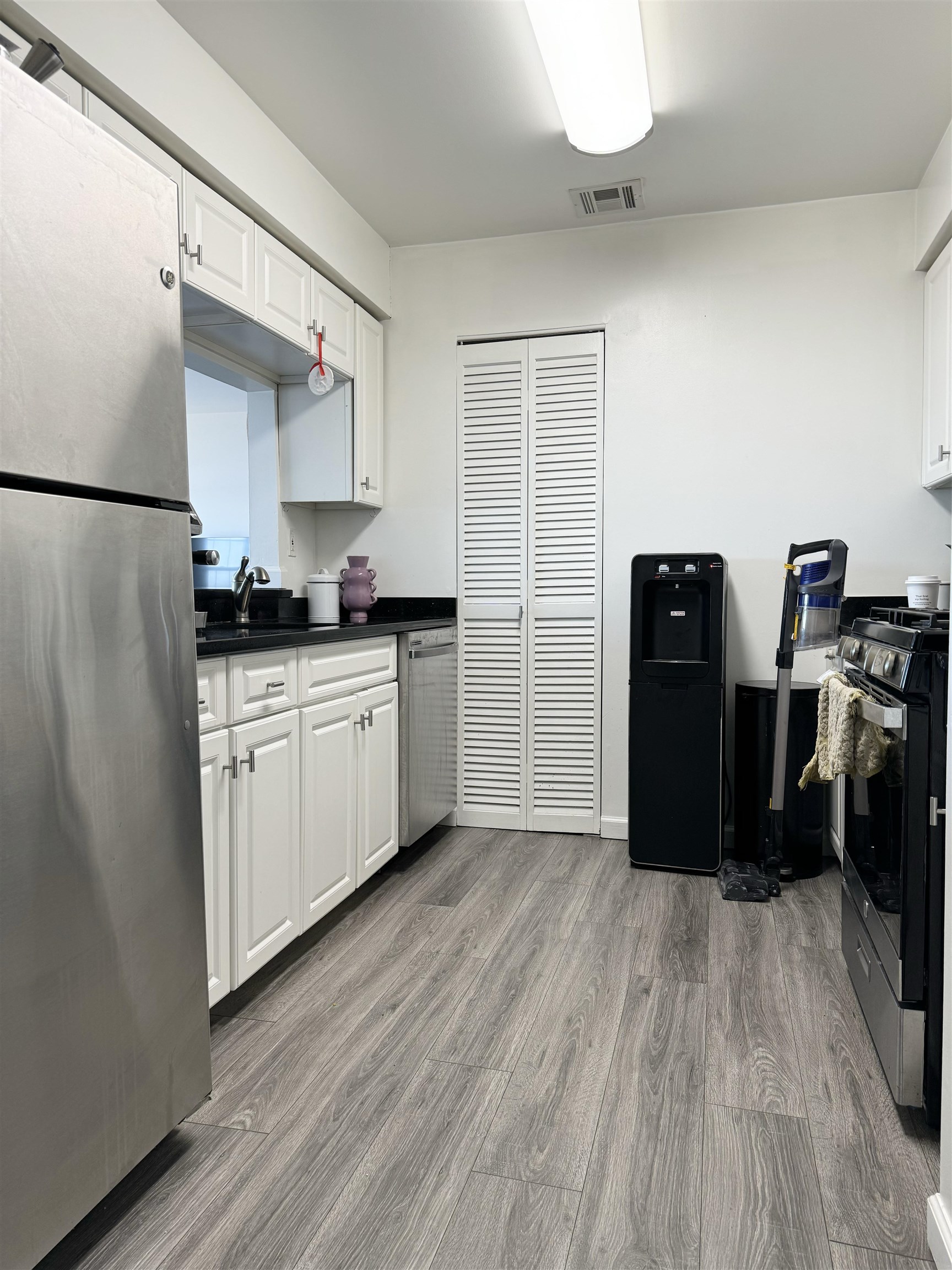 20 Bergen Ridge Road, Unit 2 North Bergen, NJ 07047 - Photo 8 of 16 a kitchen with granite countertop a refrigerator and a sink